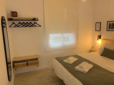 Cama o camas de una habitación en APARTAMENTO MEDINA AZAHARA