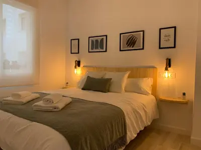 Cama o camas de una habitación en APARTAMENTO MEDINA AZAHARA