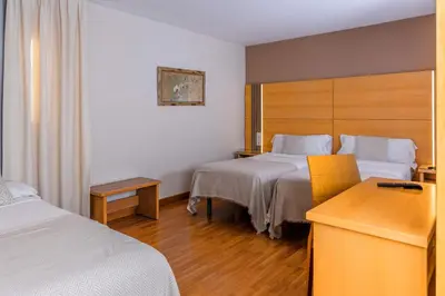 Cama o camas de una habitación en Hotel Serrano