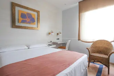 Cama o camas de una habitación en Hotel Oasis