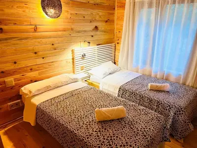 Cama o camas de una habitación en CABAÑAS DEL BOSQUE CERCA DE CORDOBA