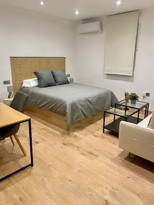 Cama o camas de una habitación en villaboutique Jaén
