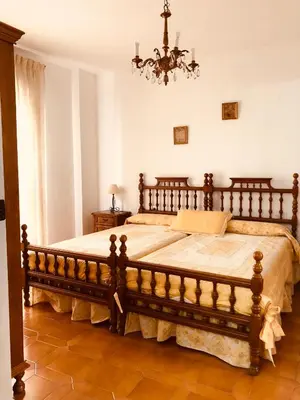 Cama o camas de una habitación en Vivienda Familiar en el Centro de Baeza