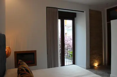 Cama o camas de una habitación en SUITE DEL CASTILLO
