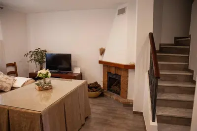 Una televisión o centro de entretenimiento en Casa Rural La Palmera