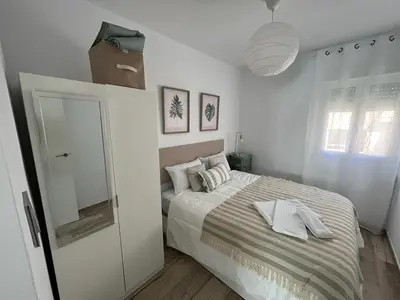 Cama o camas de una habitación en Apartamento ciudad jardín cuarta planta sin ascensor