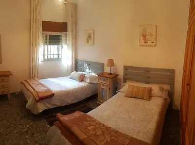 Cama o camas de una habitación en CHALET con ENCANTO en SIERRA CORDOBESA. WIFI