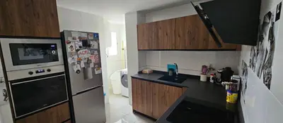 Una cocina o zona de cocina en Piso luminoso y acogedor