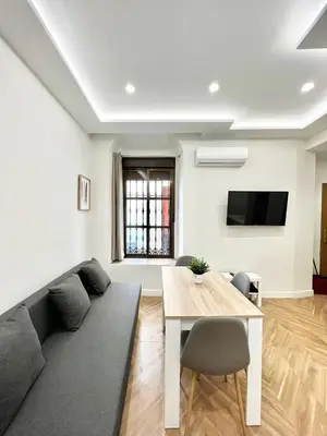 Una televisión o centro de entretenimiento en Apartamento El Horno