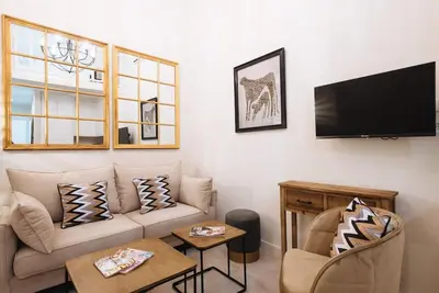 Una televisión o centro de entretenimiento en Selecta Elegante y Céntrico Apartamento