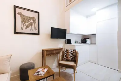 Una televisión o centro de entretenimiento en Selecta Elegante y Céntrico Apartamento