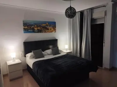 Cama o camas de una habitación en RINCÓN MURALLA DE LA MACARENA
