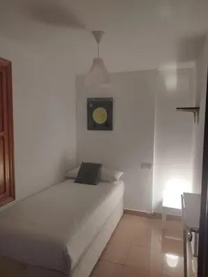 Cama o camas de una habitación en RINCÓN MURALLA DE LA MACARENA