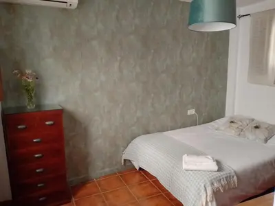 Cama o camas de una habitación en Claustro Home Casco Histórico Córdoba