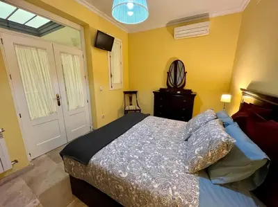 Cama o camas de una habitación en Apartamento Suite Alameda de Hercules