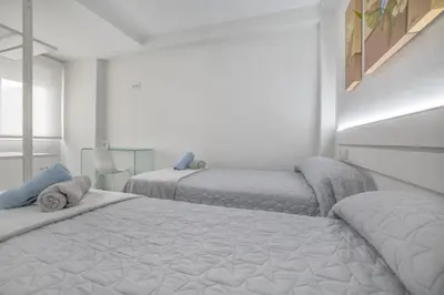 Cama o camas de una habitación en Apartamentos Haranas, parking incluido