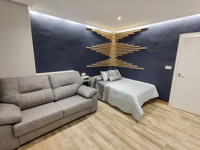 Zona de estar de Duerme a gusto - Tu habitación acogedora en Torredonjimeno
