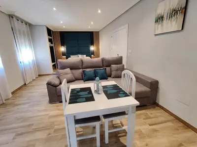 Zona de estar de Duerme a gusto - Tu habitación acogedora en Torredonjimeno