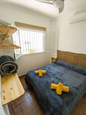 Cama o camas de una habitación en La Barbería de Miguel