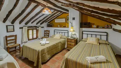 Cama o camas de una habitación en Cortijo Palitroques Carcabuey by Ruralidays