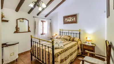 Cama o camas de una habitación en Cortijo Palitroques Carcabuey by Ruralidays
