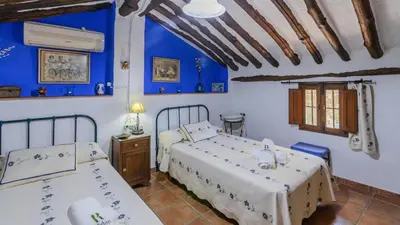 Cama o camas de una habitación en Cortijo Palitroques Carcabuey by Ruralidays