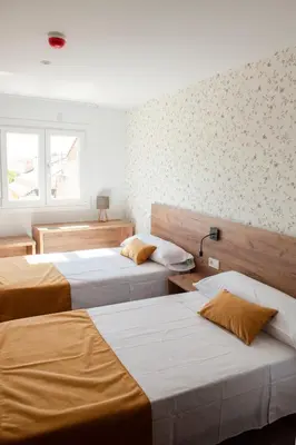 Cama o camas de una habitación en PENSION RESTAURANTE ANGEL