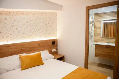 Cama o camas de una habitación en PENSION RESTAURANTE ANGEL