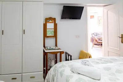 Cama o camas de una habitación en Apart Mezquita con Parking Gratuito