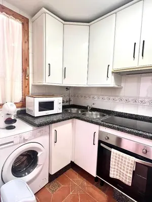 Una cocina o zona de cocina en APARTAMENTO LA MURALLA